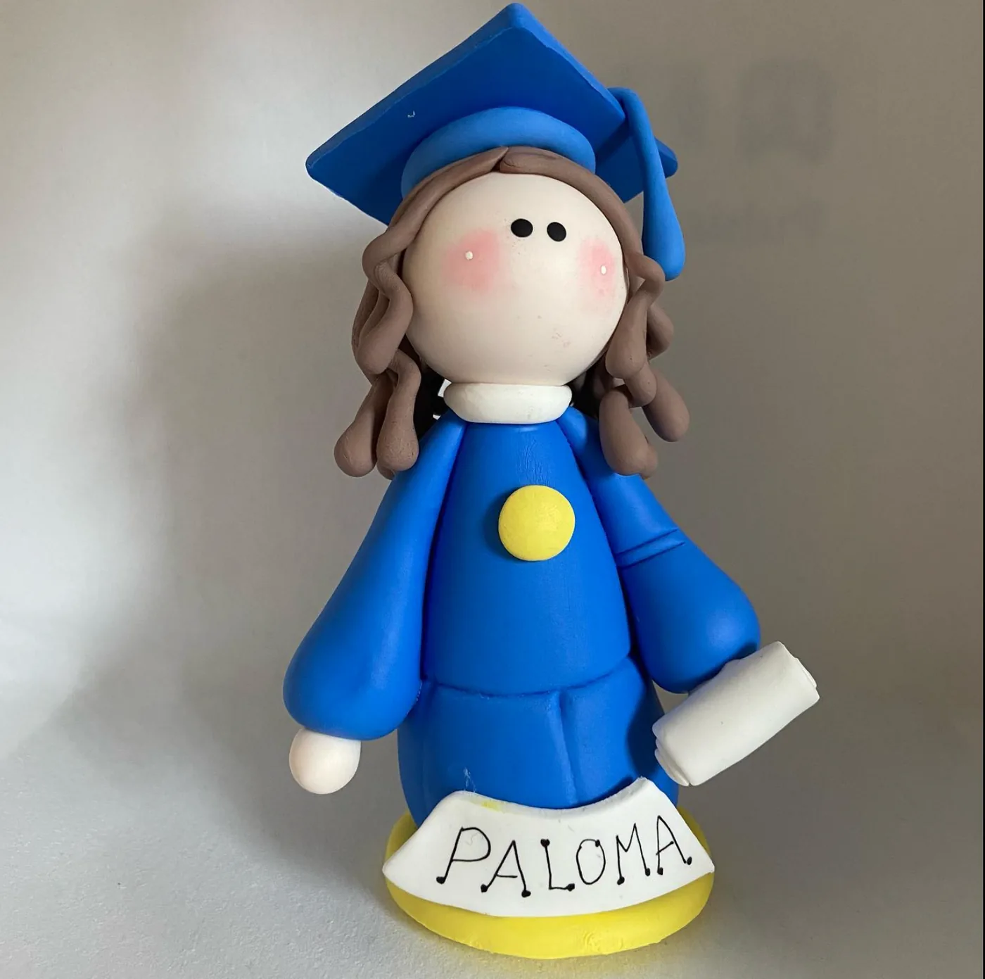 Graduada grande de porcelana fría recuerdo graduación niña